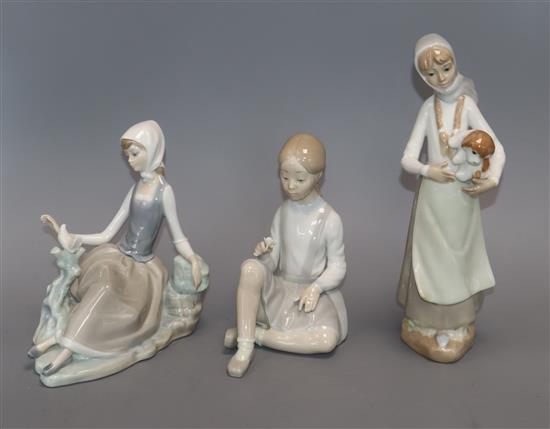 Two Lladro porcelain figures and a similar figure